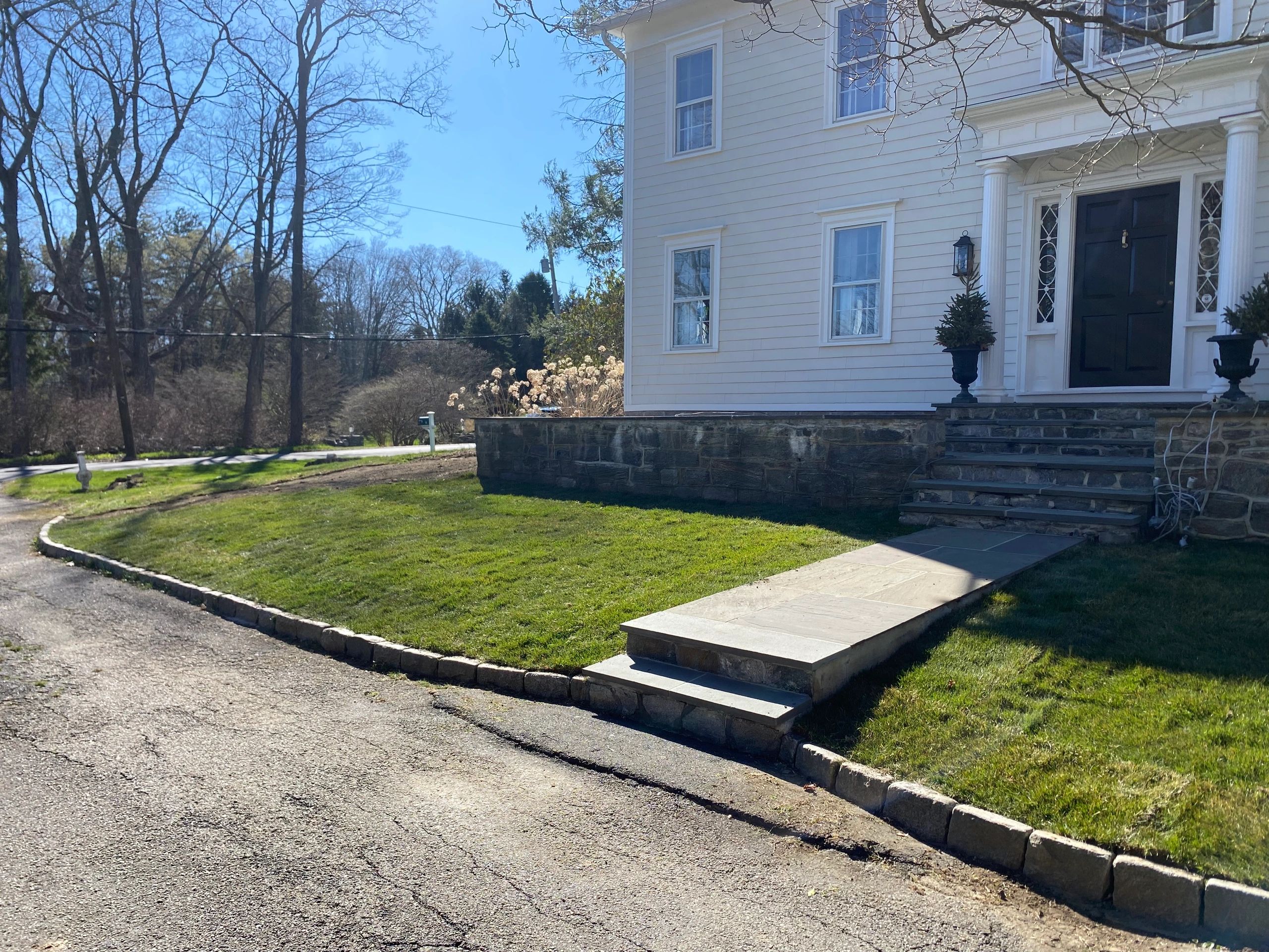 Finished front lawn after new sod installation at a home in Wilton, CT