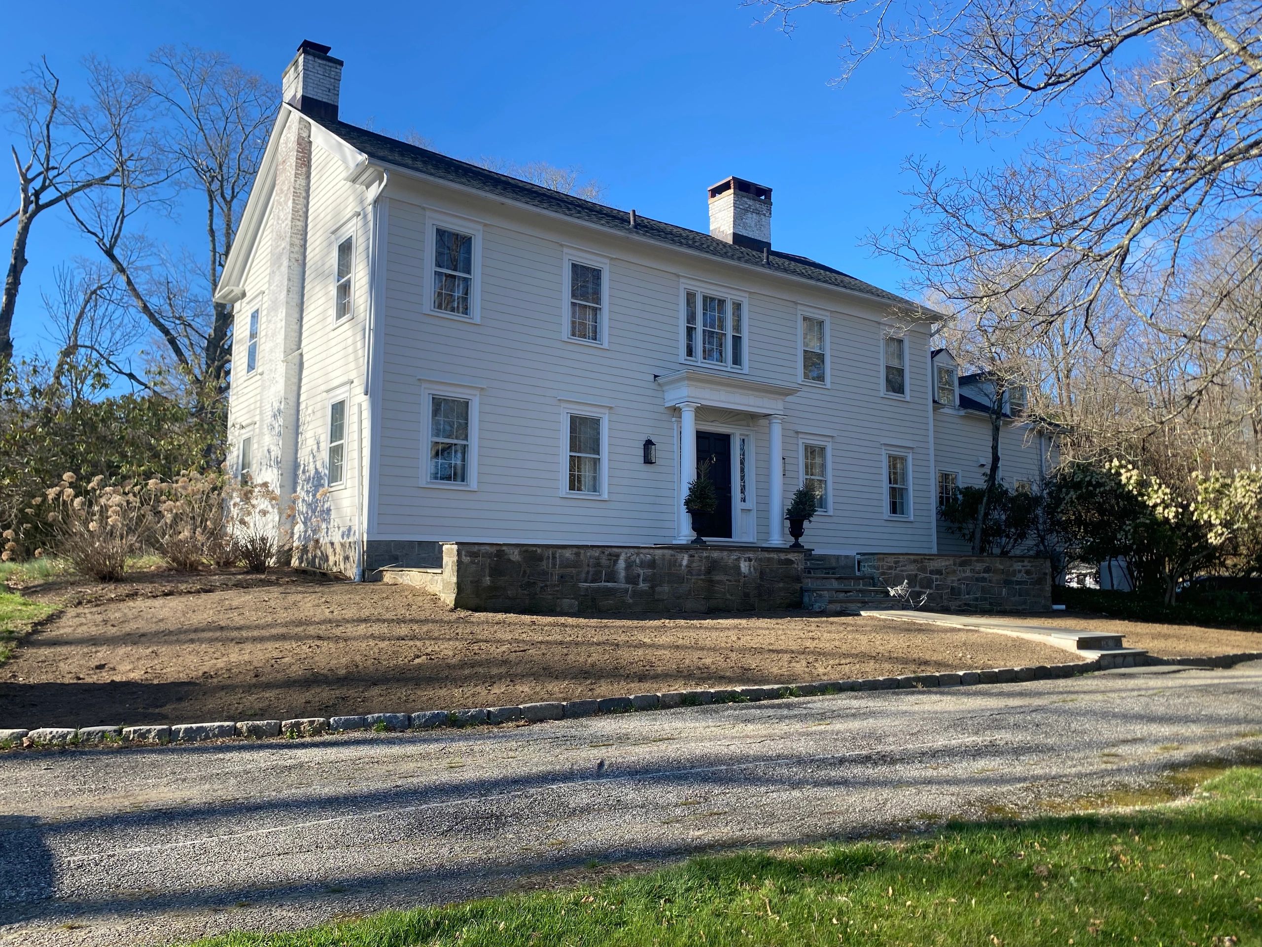 Before photo of front lawn area prepared for new sod installation at a home in Wilton, CT