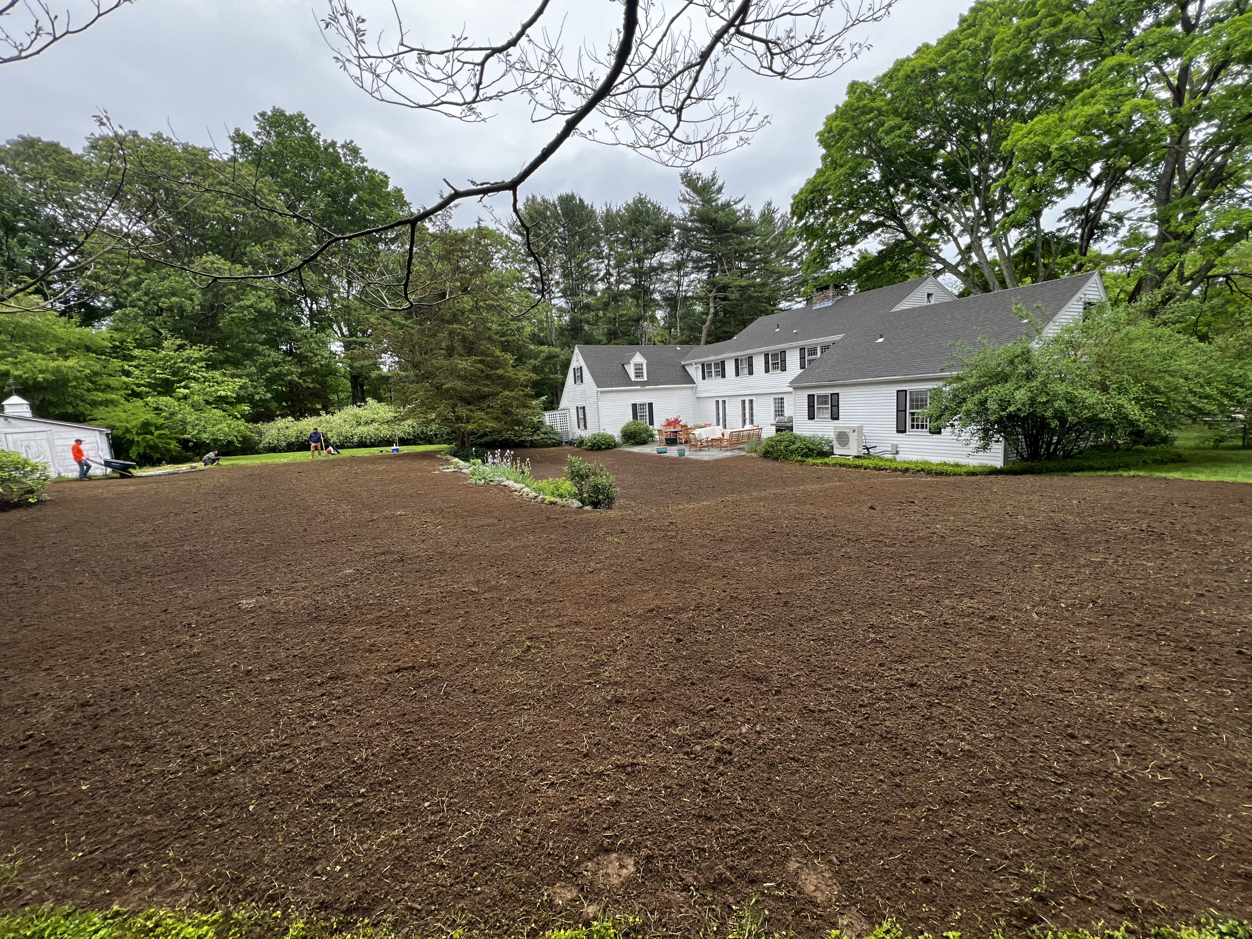 Finished 6,000 sqft sod prep in Westbrook CT — dark tilled soil, hand-raked to grade, ready for next-day sod delivery